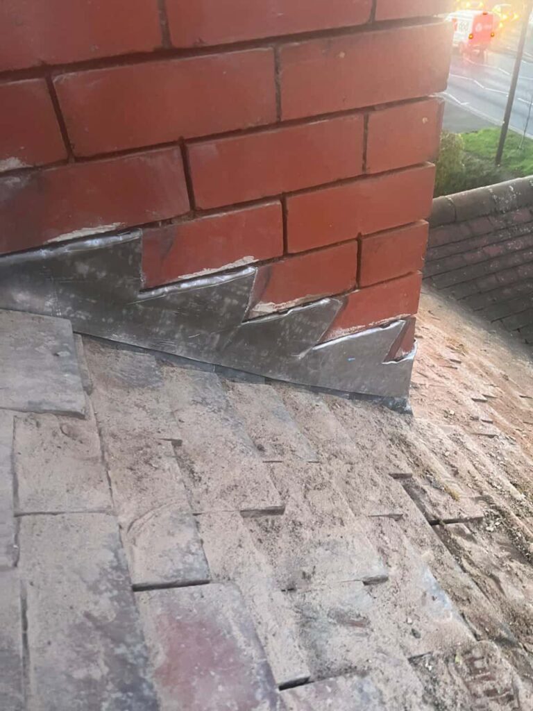 This is a photo of new leadwork being installed around an old chimney. Works carried out by LS Roofing Staines-upon-Thames